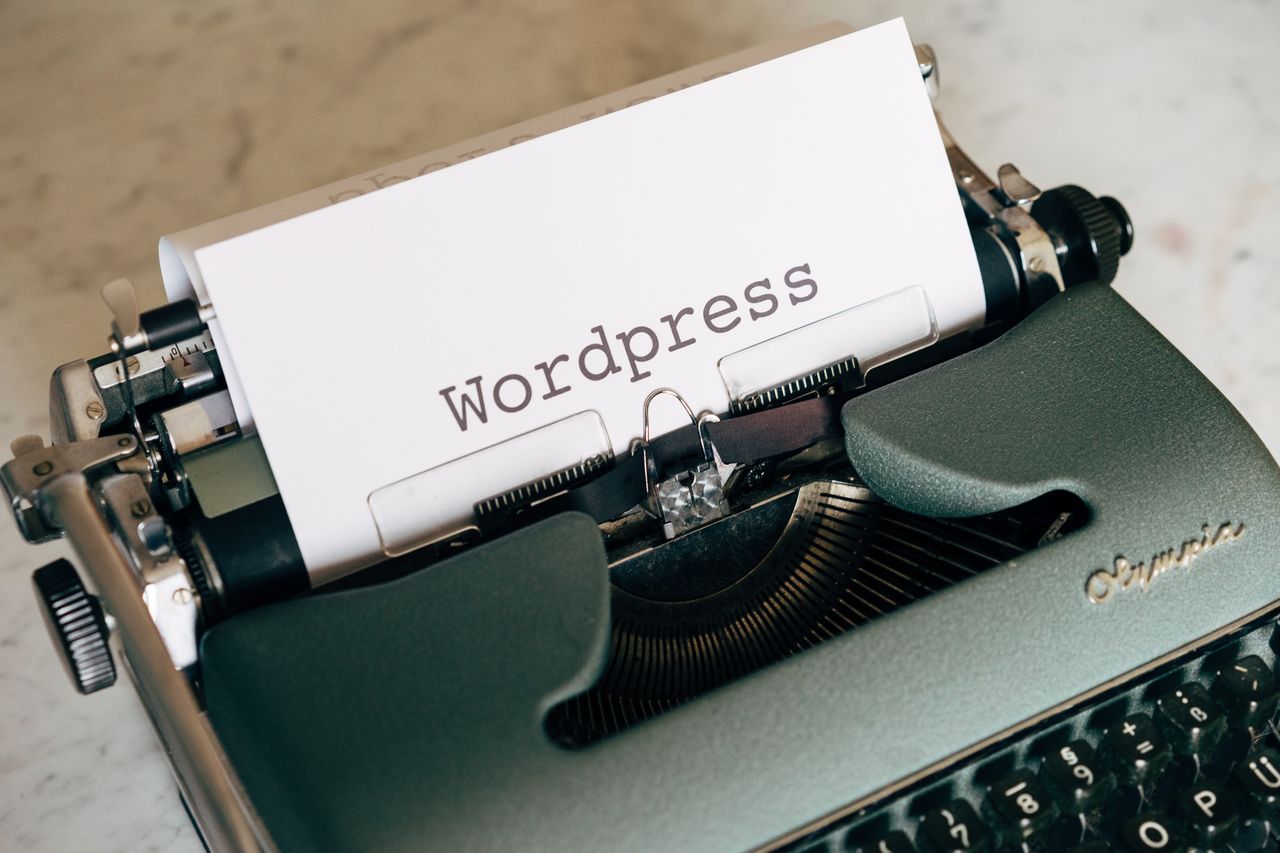 Welcome to Negative Marketing Close-up of a vintage typewriter with paper labeled WordPress.